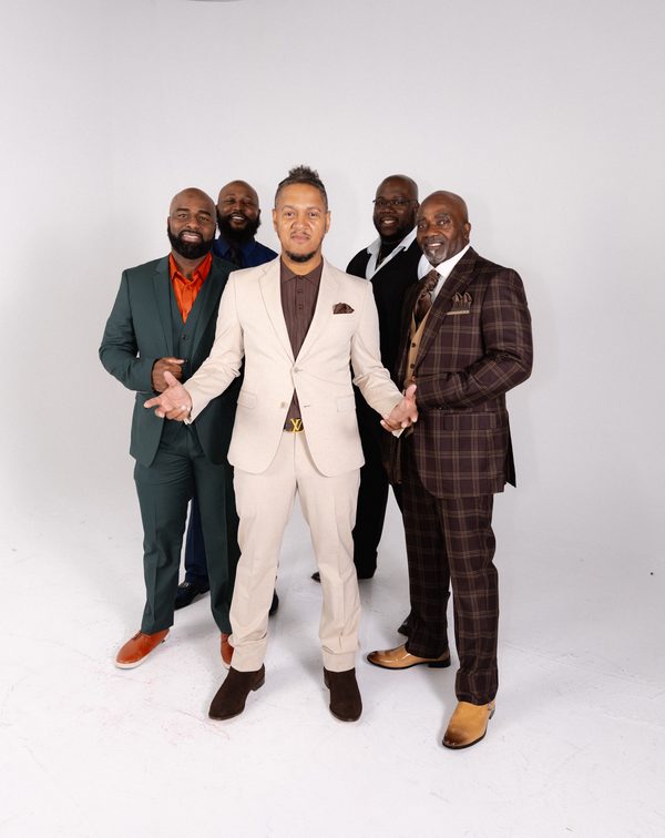 Studio portrait of the group on white