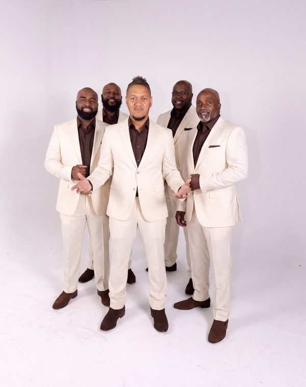 Studio portrait of the group on white